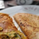 Serve east indian bottle masala omelette hot with paranthas