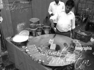 Making besan ka chila near the exit of chandni chowk metro station