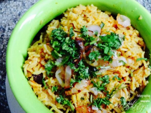 Chicken pulao or curried chicken & rice one pot meal. Serve garnished with fresh, chopped coriander.