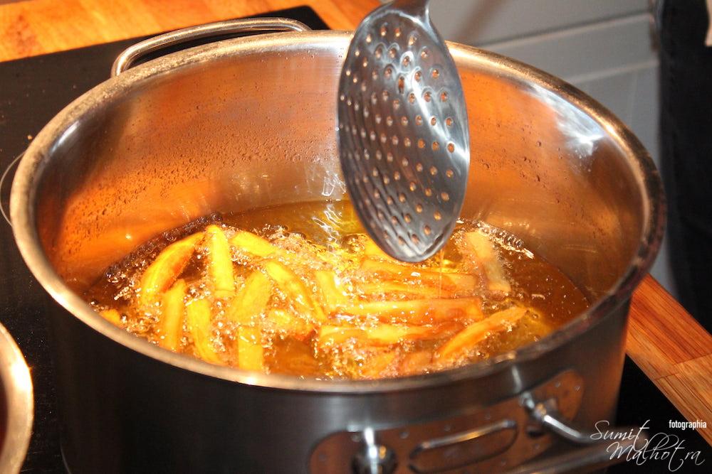 French fries frying in a pan