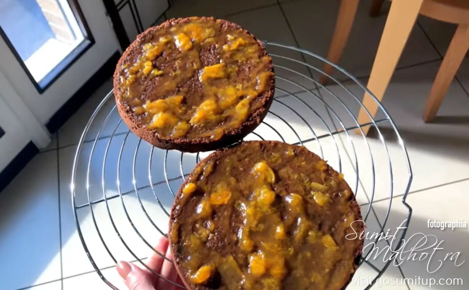 Chocolate sponge halved and layered with apricot jam