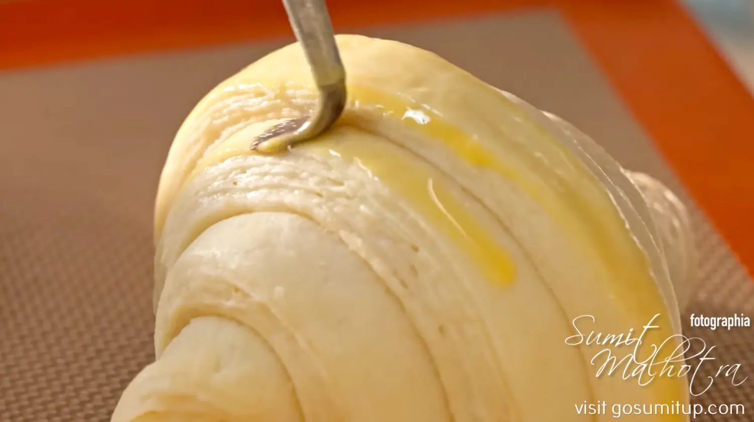 Croissant being egg washed