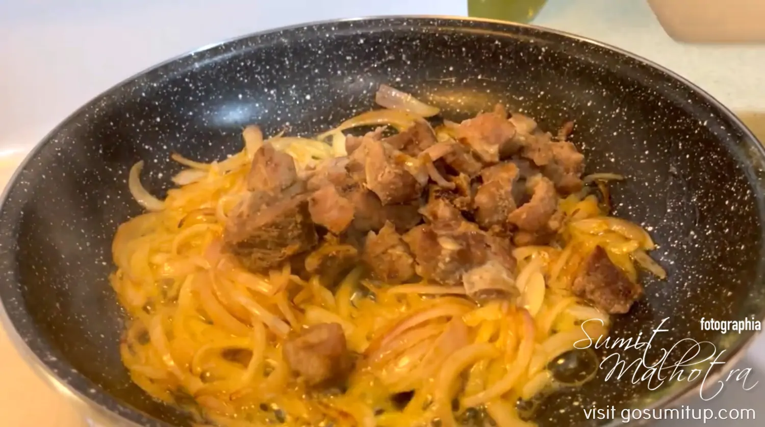 Meat is being shallow fired to assesble shah plov