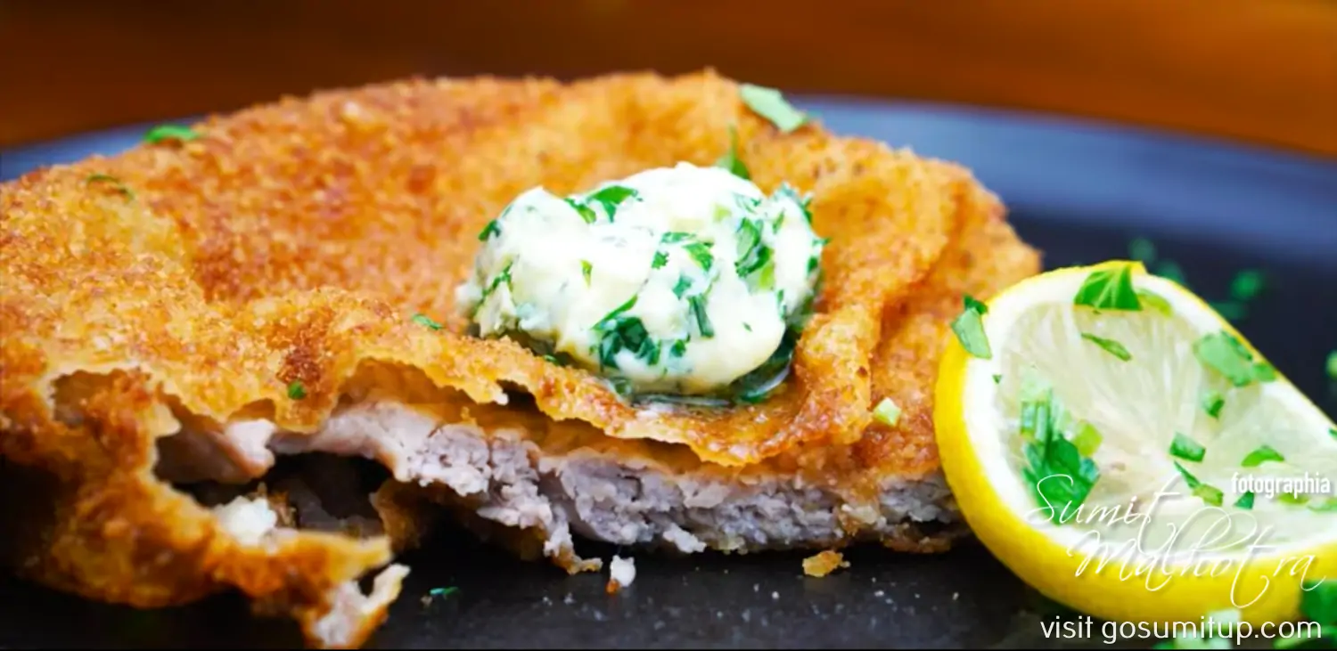 Plated Wiener Schnitzel with Parsley Butter and Lemon