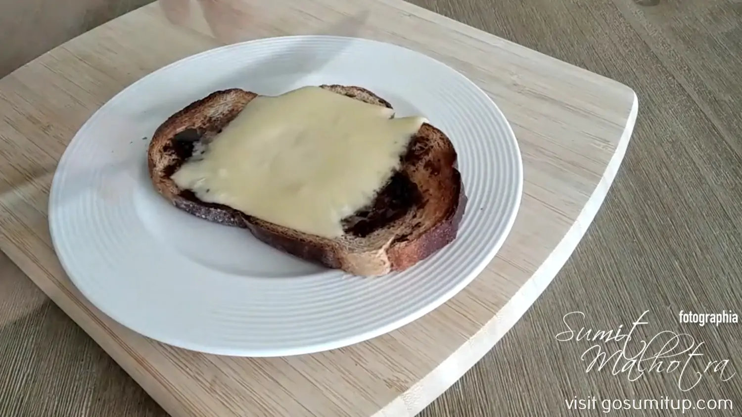 Toasted bread slice with butter with vegemite & molten cheese slice Toasted bread slice with butter with vegemite & molten cheese slice