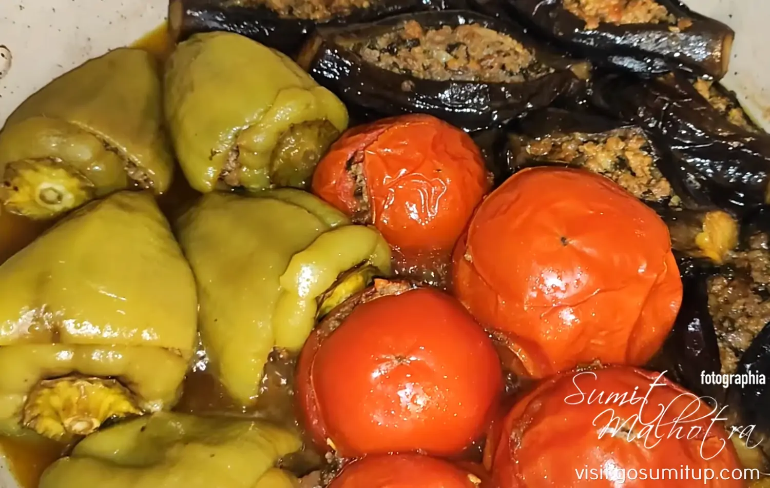 Eggplants, capsicums & tomatoes stuffed with meat filling wilted Eggplants, capsicums & tomatoes stuffed with meat filling wilted