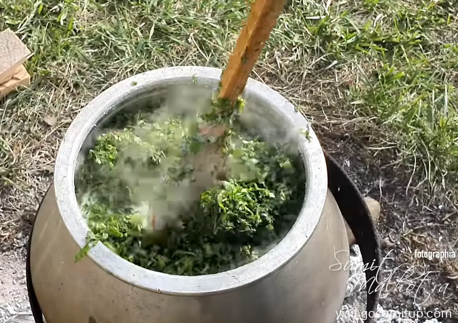Green herbs added to the boiling mixture for azerbaijani dovga