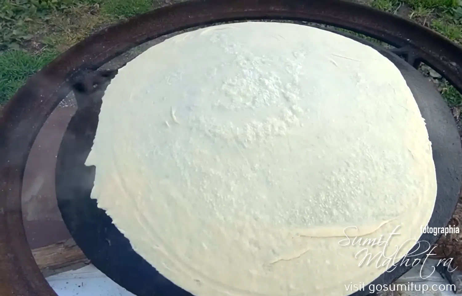 Lavash cooking on the saj Lavash cooking on the saj
