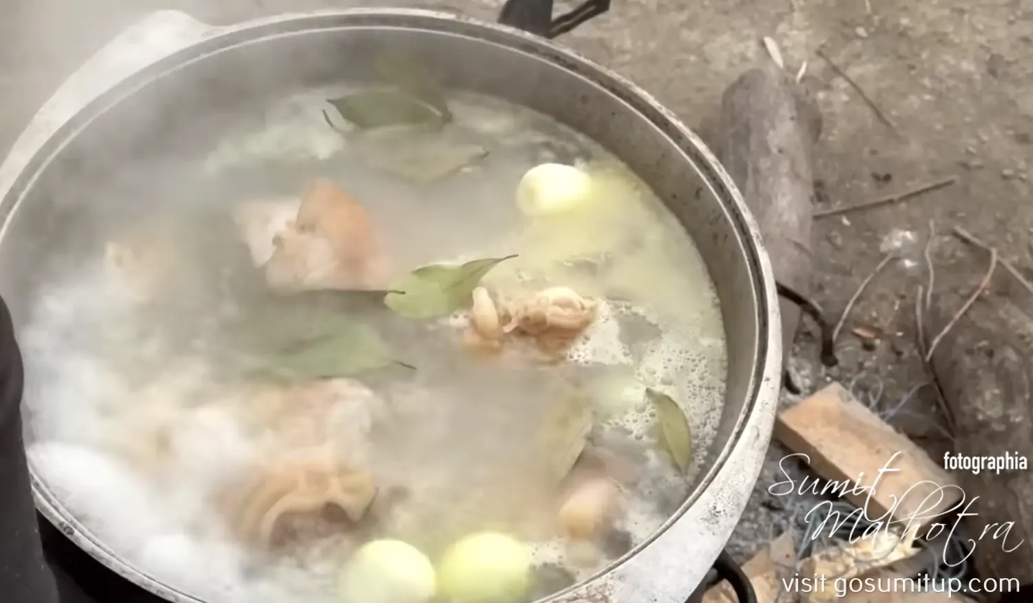 Trotters with onions & bay leaves boiling for khash