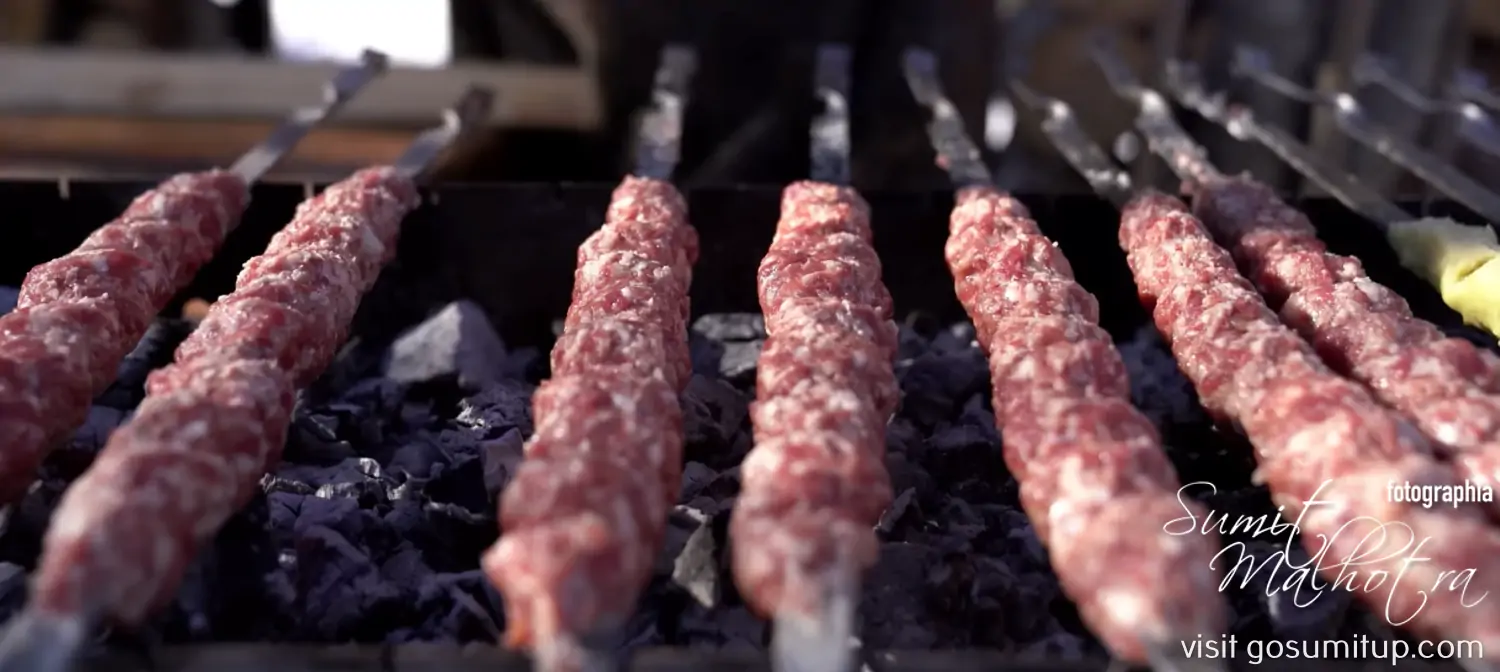 Place potatoes & lula kabab skewers on hot mangal Place potatoes & lula kabab skewers on hot mangal